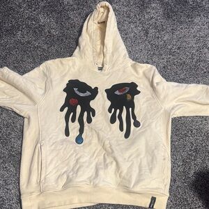 Cream Hoodie with Dripping Eye Design